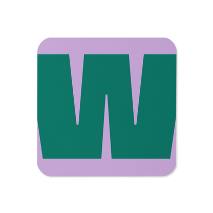 Cork-back coaster with a bold teal green fat font W letter on a lilac purple background, graphic modern design.