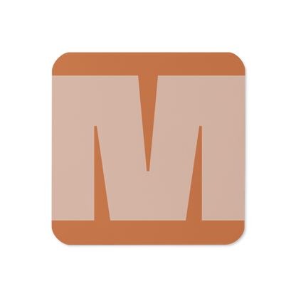 Cork-back coaster with a bold soft peach fat font M letter on an orange background, graphic modern design.