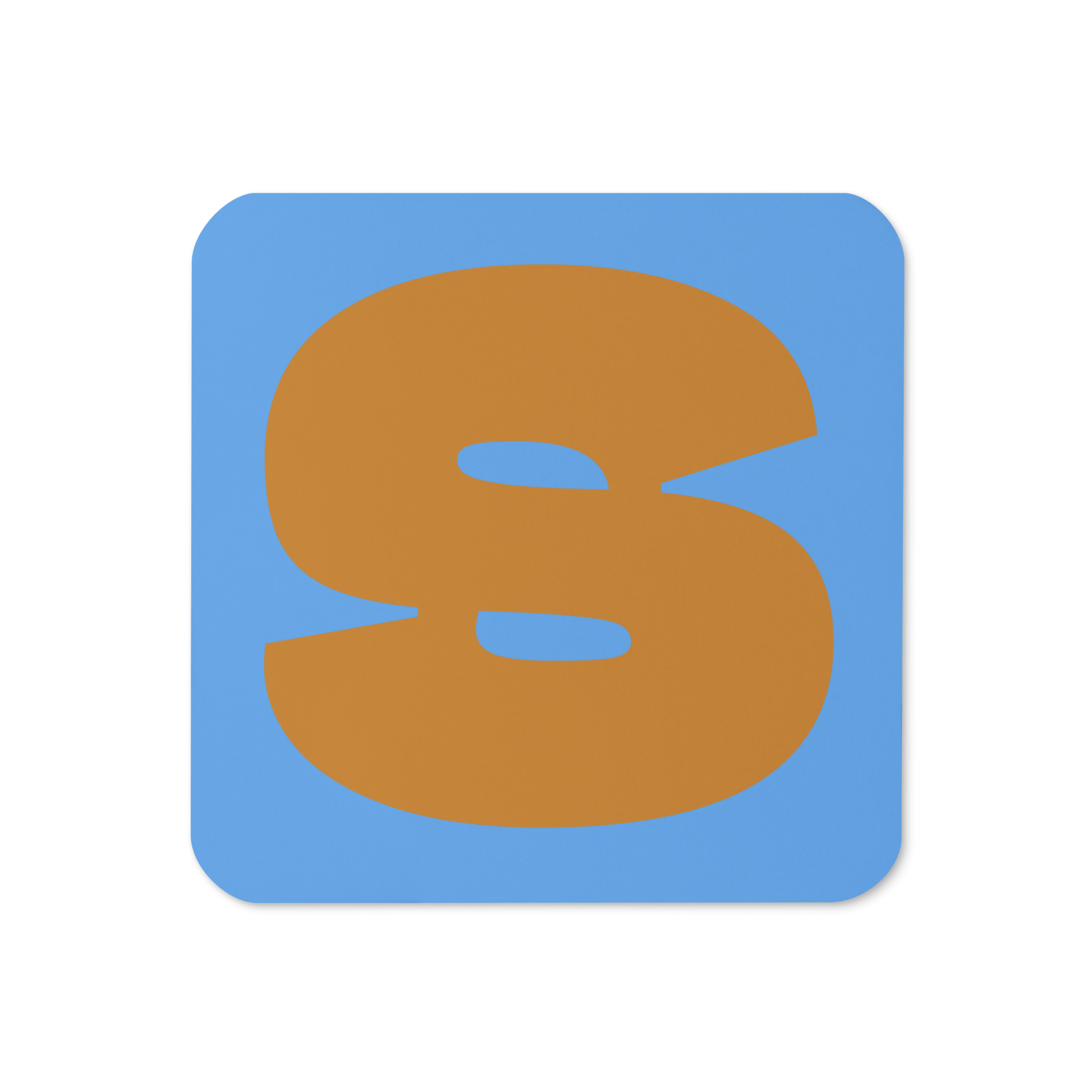 Cork-back coaster with a bold ochre fat font S letter on a sky blue background, graphic modern design.