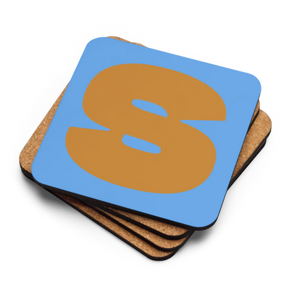Four coasters stacked on top of each other, the top with a fat font ochre S on sky blue background.